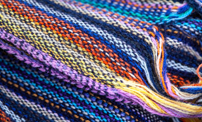 Colorful fabric with bright colored stripes, with selective focus