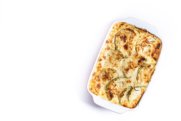 Casserole with cheese and gratin zucchini isolated on white background. Top view. Copy space