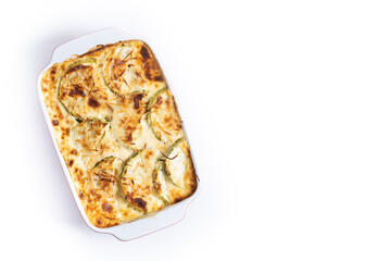 Casserole with cheese and gratin zucchini isolated on white background. Top view. Copy space