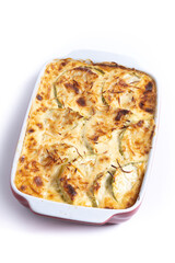 Casserole with cheese and gratin zucchini isolated on white background.