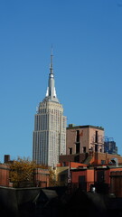 Fototapeta premium The New York city view with the skyscrapers and old buildings as background