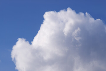 white clouds against a blue sky on a sunny day
