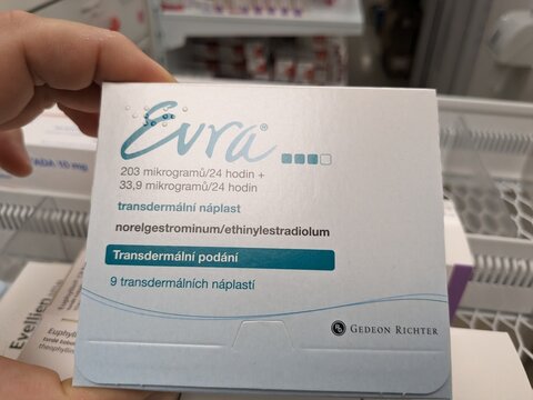 Prague, Czech Republic - July 10 2024: EVRA contraceptive patch with ETHINYLESTRADIOL and NORELGESTROMIN active substances by JANSSEN, used for birth control and menstrual regulation.

