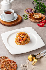 Asian fried rice (Indonesian: nasi goreng) with squid, prawns, and fish baso