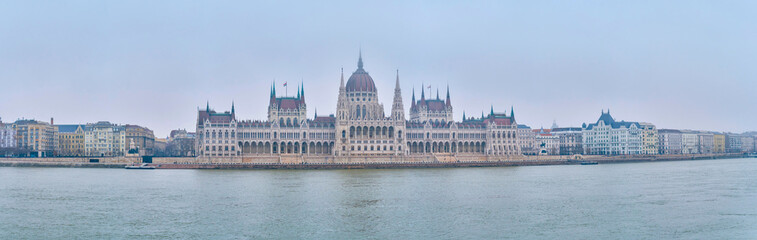 Fototapeta premium Panorama of Pest side with Parliament building in morning fog, Budapest, Hungary