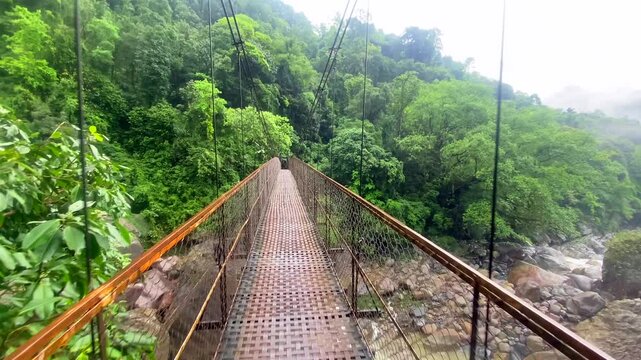 New cable bridge Near double decker living root bridge in nongriat village in cherrapunjee meghalaya India. This bridge is formed by training tree roots over years to knit together.