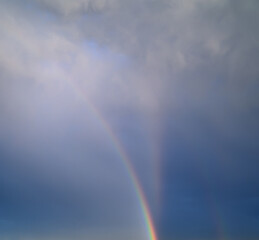 Natural colorful rainbow in clouds.