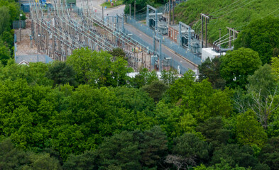 a small electricity substation in the UK set amongst trees