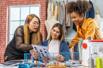 Collaboration and creativity in fashion design of teamwork, three diverse and talented designer...