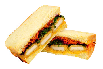 katsu sando sandwiches, filled with panko breaded chicken, katsu mayo and pickled cabbage isolated on a white background
