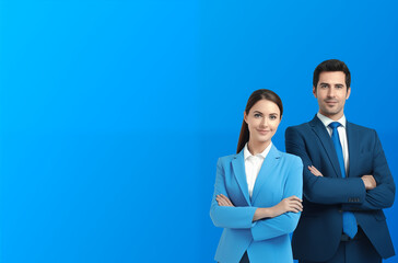 Professional Business Team Standing with Arms Crossed in Matching Blue Suits Against a Solid Blue Background