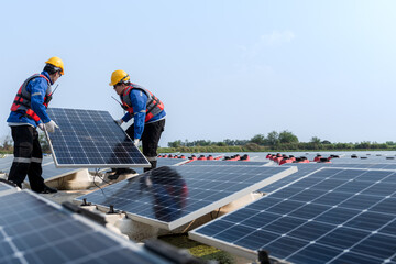 Photovoltaic engineers work on floating photovoltaics. workers Inspect and repair the solar panel equipment floating on water. Engineer working setup Floating solar panels Platform system on the lake.