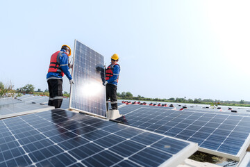 Photovoltaic engineers work on floating photovoltaics. workers Inspect and repair the solar panel equipment floating on water. Engineer working setup Floating solar panels Platform system on the lake.