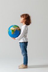 Fototapeta premium young child holding globe, world, earth, future, sustainability, hope, dream, responsibility, education, childhood, global citizen