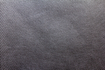 Black spunbond fabric. black nonwoven polypropylene fabric texture background