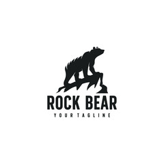 the bear logo stands on a rock cliff