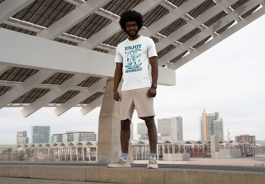 Mockup Of Man Wearing Customized T-Shirt Under Canopy