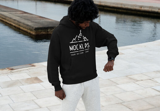 Mockup Of Man Wearing Customizable Hoodie Checking Time