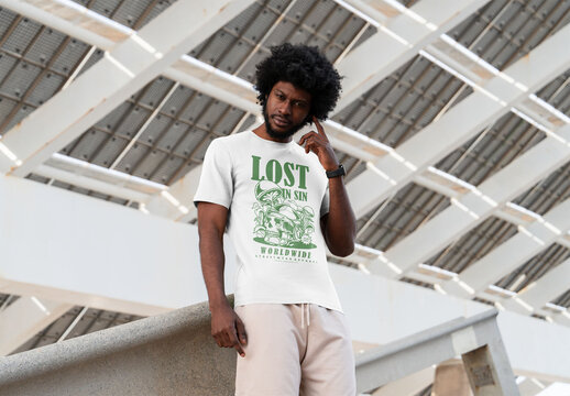 Mockup Of Man Wearing Customized T-Shirt Under Structure