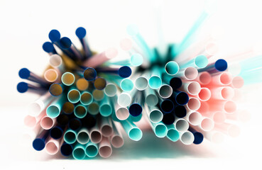 A decorative image of colorful straws on a white background. A Bunch of colorful straws