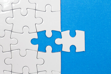 Jigsaw puzzle with one piece missing