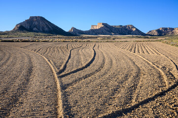 Plowed farmland in desert landscape, Bardenas reales national park, Navarro, Spain.