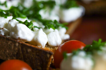 Slice of bread with cottage cheese and chives. Healthy meal with tomatoes