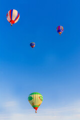 Floating balloons in the blue sky