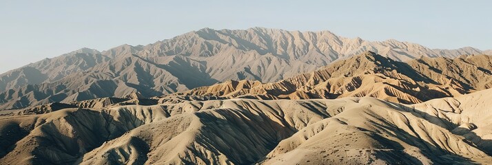 Photo of a vast mountain range with a gray sky in the background
