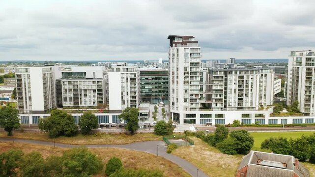 An aerial view of contemporary apartment buildings in Leopardstown, Dublin, showcasing sleek architectural designs with greenery and urban elements. Perfect for urban development and real estate theme