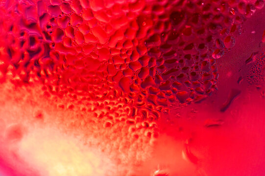 Full frame of wet red glass