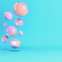 Pink flying inflatable beach ball on bright blue background in pastel colors