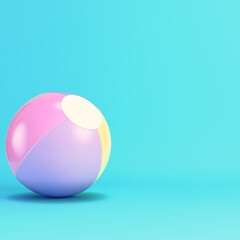 Pink inflatable beach ball on bright blue background in pastel colors