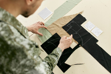 Fashion designer examining fabric samples at workshop