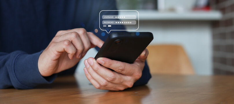 close up customer man hand use smartphone and type username with password to log in private account on website with virtual icon for security system and prevent phishing concept