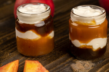 fresh yogurt with jam and pieces of ripe nectarine