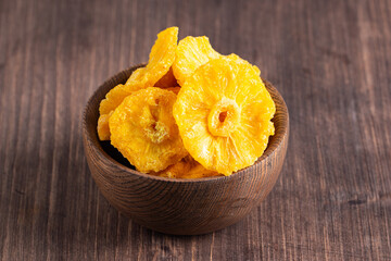 Dried pineapple in a bowl. Dried fruits. 