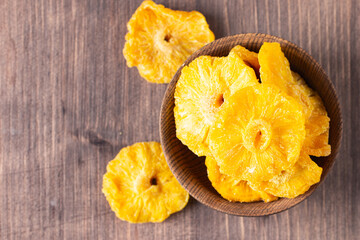 Dried pineapple in a bowl. Dried fruits. 