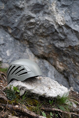 Sport climbing helmet among the rocs