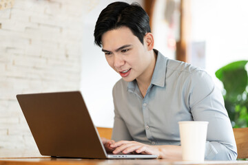 Young business man working at a coffee shop