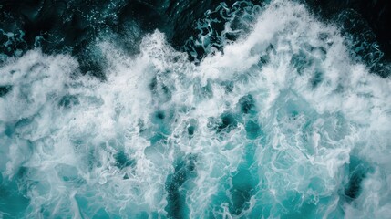 Obraz premium A dynamic view of powerful, foamy ocean waves, merging into one another against deep blue water, showcasing the rhythmic and unpredictable nature of the ocean.