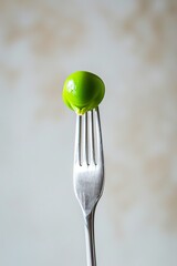 A fork tine piercing a green pea in a minimalistic setting  AI generated illustration