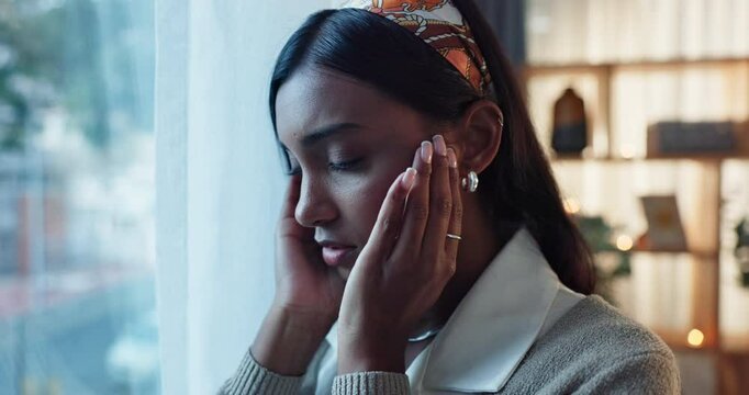 Stress, headache and woman at house window with worry, fear and overthinking mistake in her home. Mind, psychology and girl person frustrated by doubt, panic or overwhelmed by mental health crisis