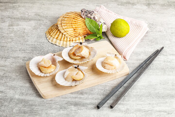 Raw natural scallop in its shell