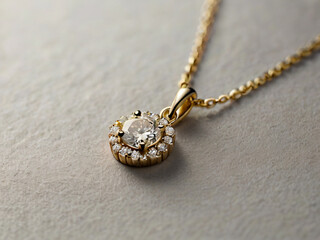 A gold necklace with a single diamond pendant on a grey background.