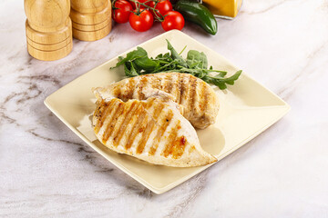 Grilled chicken breast served arugula