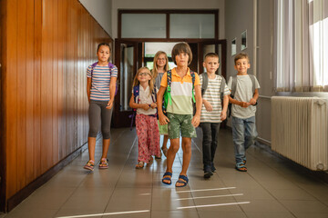 portrait of young happy students come, enter to school