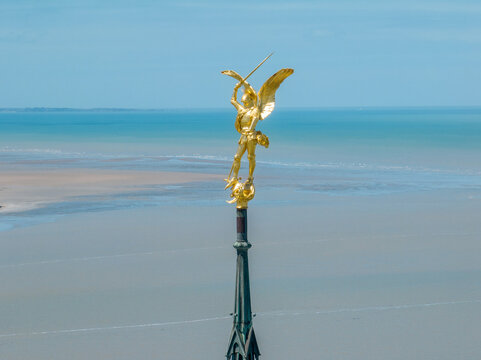 Aerial view of the Statue of Saint Michel and the dragon, Spire of Mont Saint Michel Abbey, Normandy. France