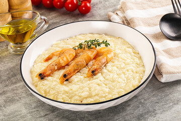 Italian risotto with prawn served thyme