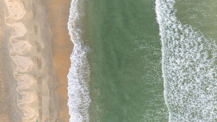 Aerial view of Beautiful Beach Sand and waves, Top view from drone.